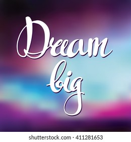 Card with abstract background and hand written lettering. Dream big