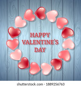 Cartel con marco redondo de corazones rosados sobre un fondo de textura de madera azul. Postales para el Día de San Valentín y el Día Internacional de la Mujer. En estilo 3D realista. Ilustración del vector