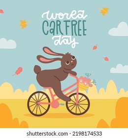 Card or banner for world car free day. Autumn landscape with bunny riding the bicycle with lettering text. Flat hand drawn vector illustration. Sepember 22