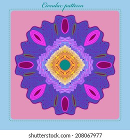 Card with circular multicolored ornament  on a light rosy rounded rectangle and text on a light blue frame. Handmade.