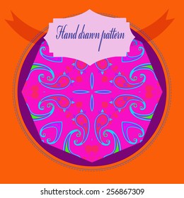 Card with circular oriental pattern of floral motif, label on a dark pink  circle. Hand drawn.