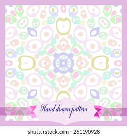 Card with circular pattern of colored doodles, spots, label. Hand drawn.