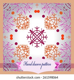Card with circular pattern of colored snowflakes, label.  Hand drawn. 