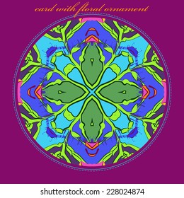 Card with circular  pattern of floral motif, branches and text   on a multicolored circle and orange text on a  frame.Handmade.