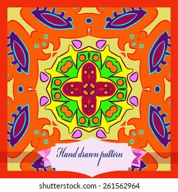 Card with colored circular pattern of floral motif, label. Hand drawn.