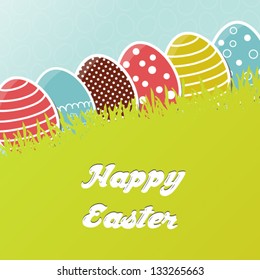 Card with colorful Easter eggs in grass