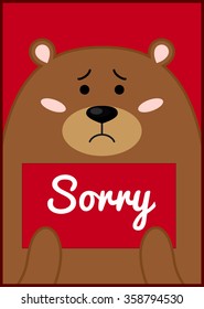 Card with cute brown bear holding "sorry"sign.