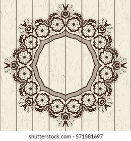 Card design with mandala on wooden texture