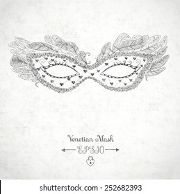 Card with festive venetian mask decorated with feathers on white textured background