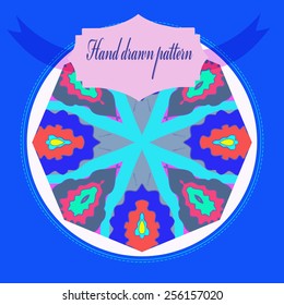Card with floral circular pattern,  blue  frame, label on a   white  circle. Hand drawn.