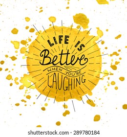 Card with hand drawn typography design element for greeting cards, posters and print. Life is better when you're laughing on watercolor painted yellow background with splashes