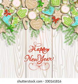 Card happy new year with collection of gingerbread and Christmas-tree branches on background of wood texture