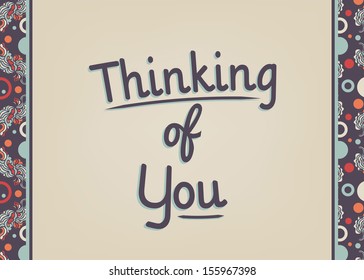 A card with a retro design that says thinking of you.