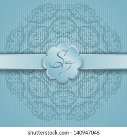 card with a round ornament and ribbon
