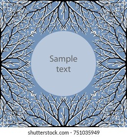 Card with snowbound tree twigs on blue sky background