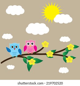 Card with two owls on branch at day