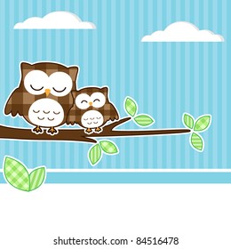 Card with two owls on branch at day