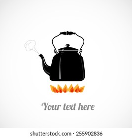 Card wit black hot boiling kettle on fire