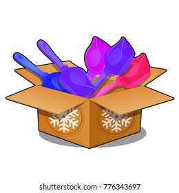 Cardboard box with colored plastic shovels for snow isolated on white background. Sample of poster, party holiday invitation, festive card. Vector cartoon close-up illustration.