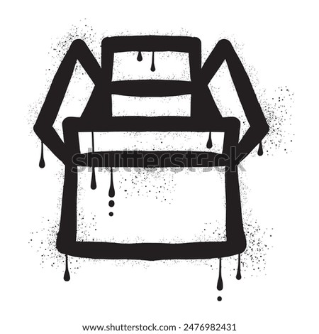 Cardboard box drawn with black spray paint graffiti