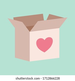 Cardboard box with a love heart on it for donating or giving concept to help those affected by COVID-19 pandemic