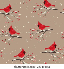 Cardinal bird beautiful winter seamless. Cardinal sitting on the snowy branch with berries.
