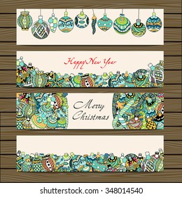 Cards with Christmas toys on wooden background