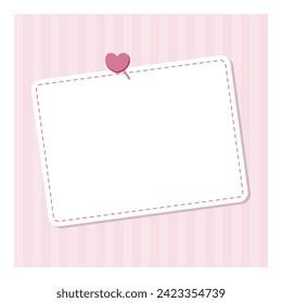 A card-shaped memo with a heart-shaped pin stuck on a pink wall