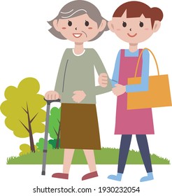 A care helper taking a walk together for elderly care