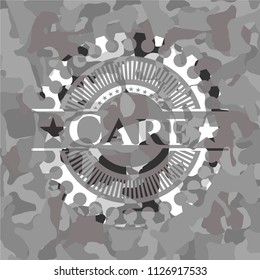 Care on grey camouflaged texture