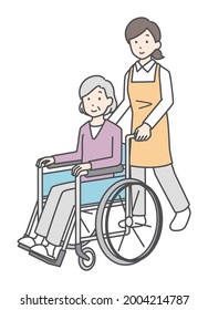 Care staff and senior women in wheelchairs.