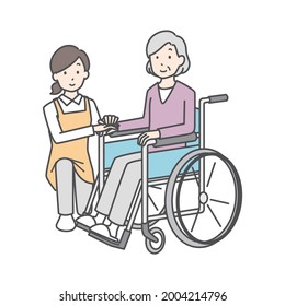 Care staff and senior women in wheelchairs.