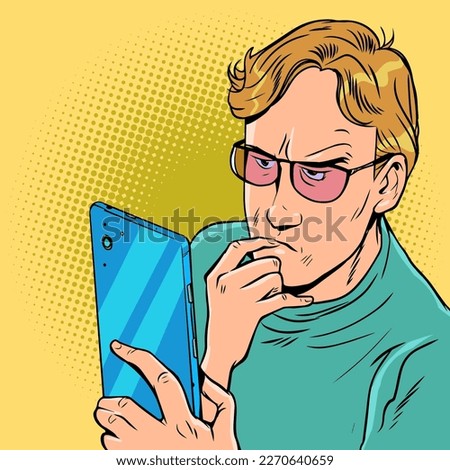 Careful study of materials. Serious attitude to business. Internet search using smartphone. A man with glasses looks thoughtfully into the phone.