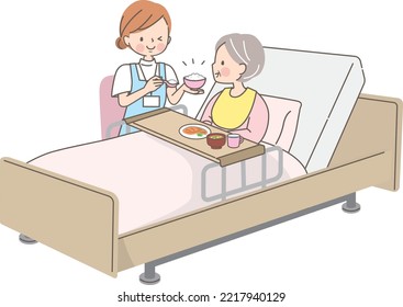 Caregiver assisting a senior woman with meals