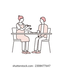 caregiver who helps a woman eat
