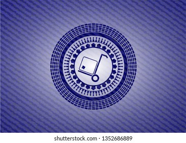 cargo icon inside badge with denim background