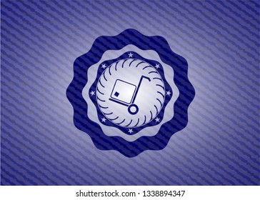 cargo icon inside emblem with denim texture