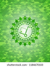 cargo icon inside green emblem with triangle mosaic background