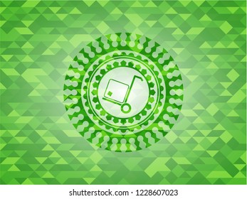 cargo icon inside green emblem with mosaic ecological style background