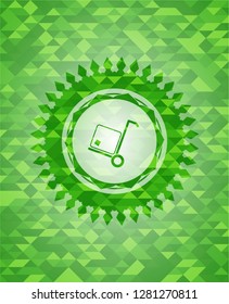 cargo icon inside green emblem with mosaic ecological style background