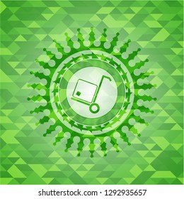 cargo icon inside green emblem with mosaic ecological style background