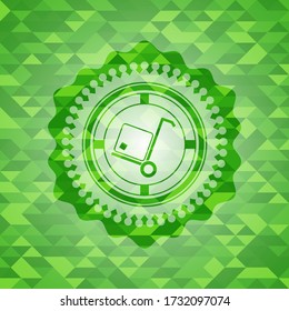 cargo icon inside green emblem with mosaic ecological style background. 