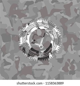 cargo icon inside grey camouflage emblem