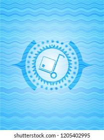 cargo icon inside light blue water badge background.