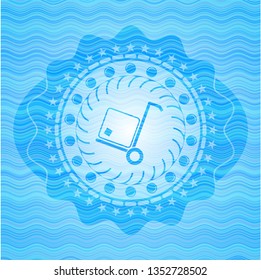 cargo icon inside light blue water wave emblem.