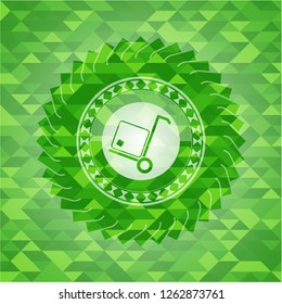 cargo icon inside realistic green emblem. Mosaic background