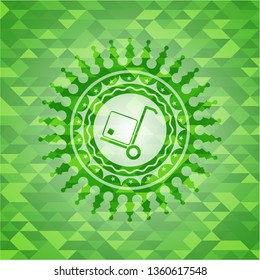 cargo icon inside realistic green emblem. Mosaic background