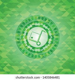 cargo icon inside realistic green emblem. Mosaic background