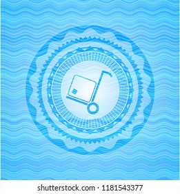 cargo icon inside sky blue water wave badge background.