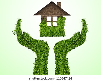 caring for the environment, arms out of the grass with a green home. The concept of ecology